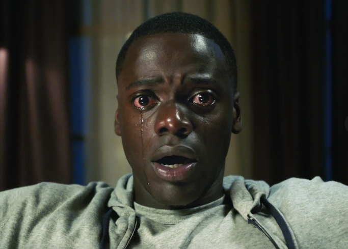 Still from the movie Get Out, where the main character, Chris, is hypnotized.